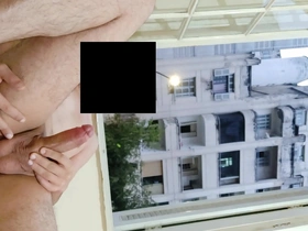 A daring solo session at a hotel near the neighborhood leads to a risky dick flash at an open window, hoping for a thrilling neighbor view.