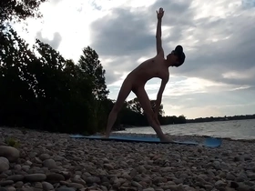 Slender, sun-kissed Jon Arteen, a passionate nudist, practices yoga on a naturist beach. His flexible poses and tantalizing nudity make for a captivating yoga video, showcasing the beauty of naturism and nudist yoga.