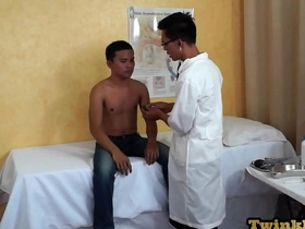 Slender Asian twink visits the doctor, unknowingly seeking more than a medical check-up. The medic, a bareback enthusiast, takes advantage, examining and pleasuring him. The examination table becomes a stage for their passionate encounter.